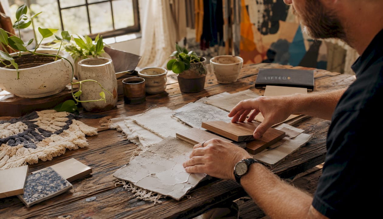 Interior styling tips 2026: warm, personal, and tactile 2 Designer working with fabric and materials