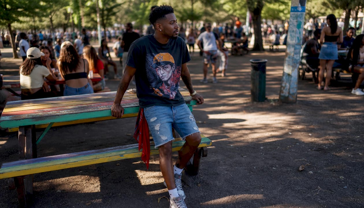 Man styling oversized film franchise graphic tee