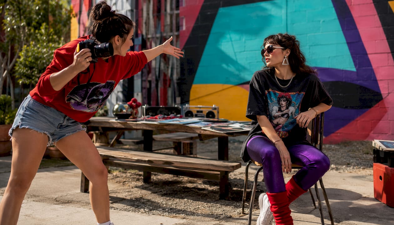 Fashion photographer directing retro merchandise shoot