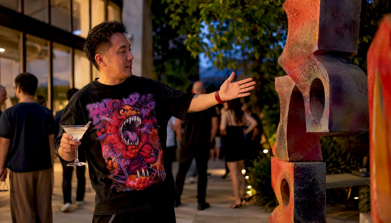 Man wearing art tee at gallery event