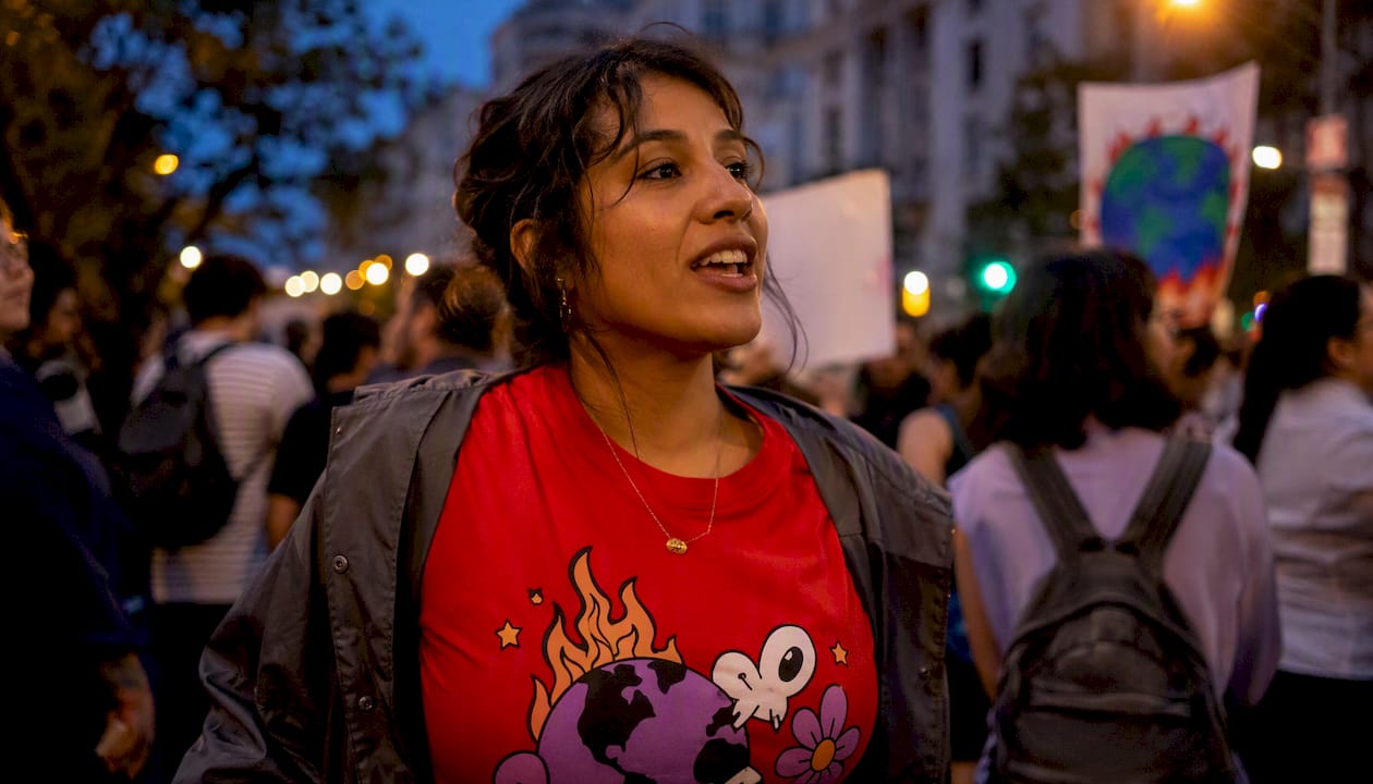 Climate activist wearing slogan tee at march