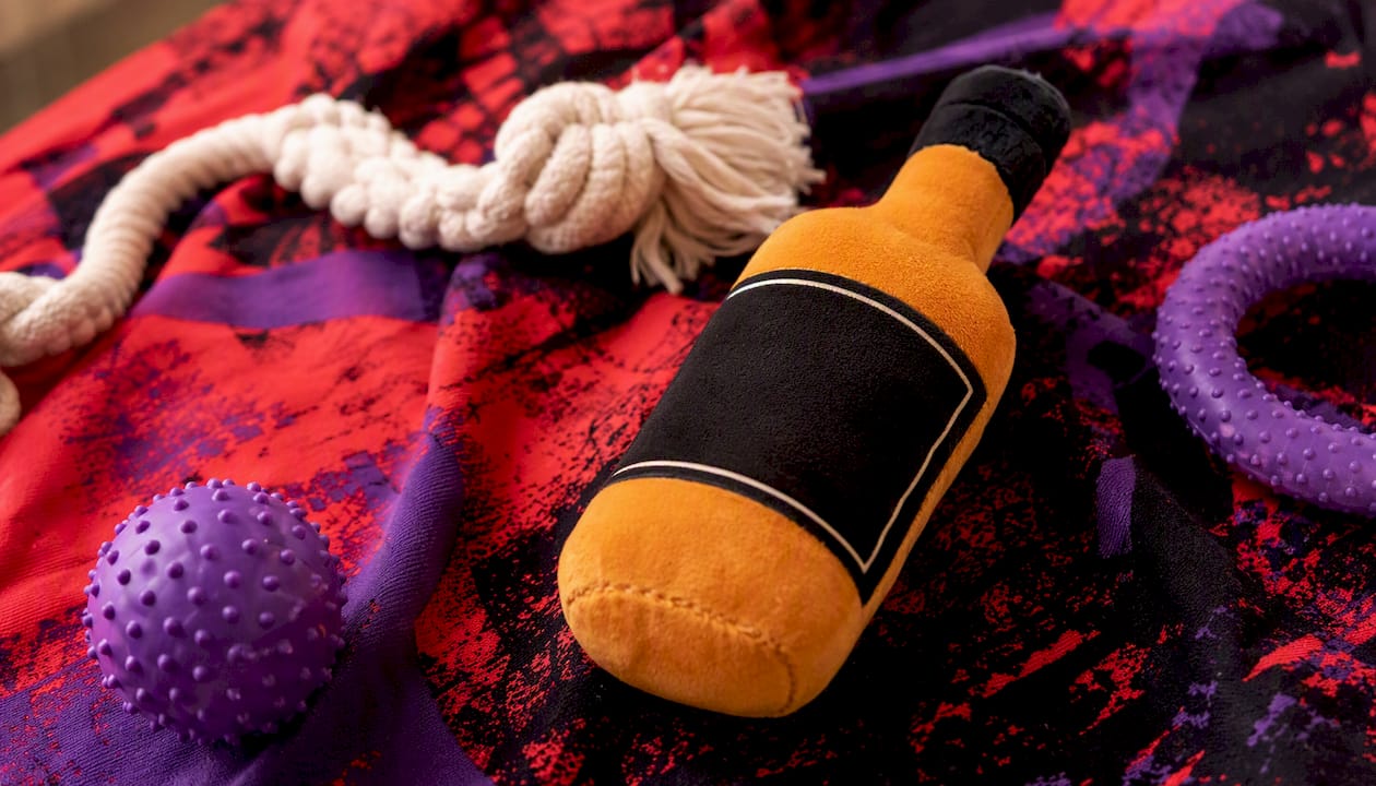 Silhouetted parody dog toy resembling whiskey bottle