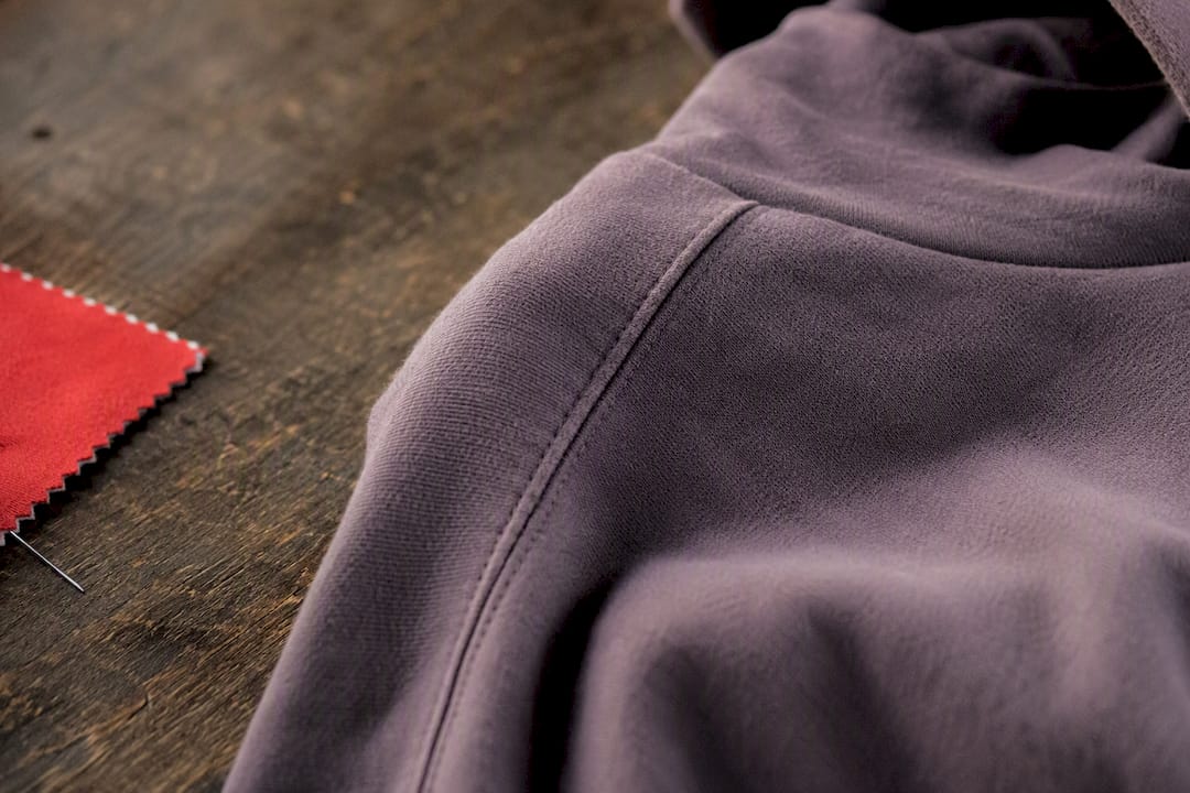 Close-up of hoodie shoulder seam detail