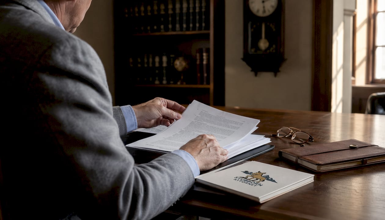 Hands reviewing pretrial motion documents