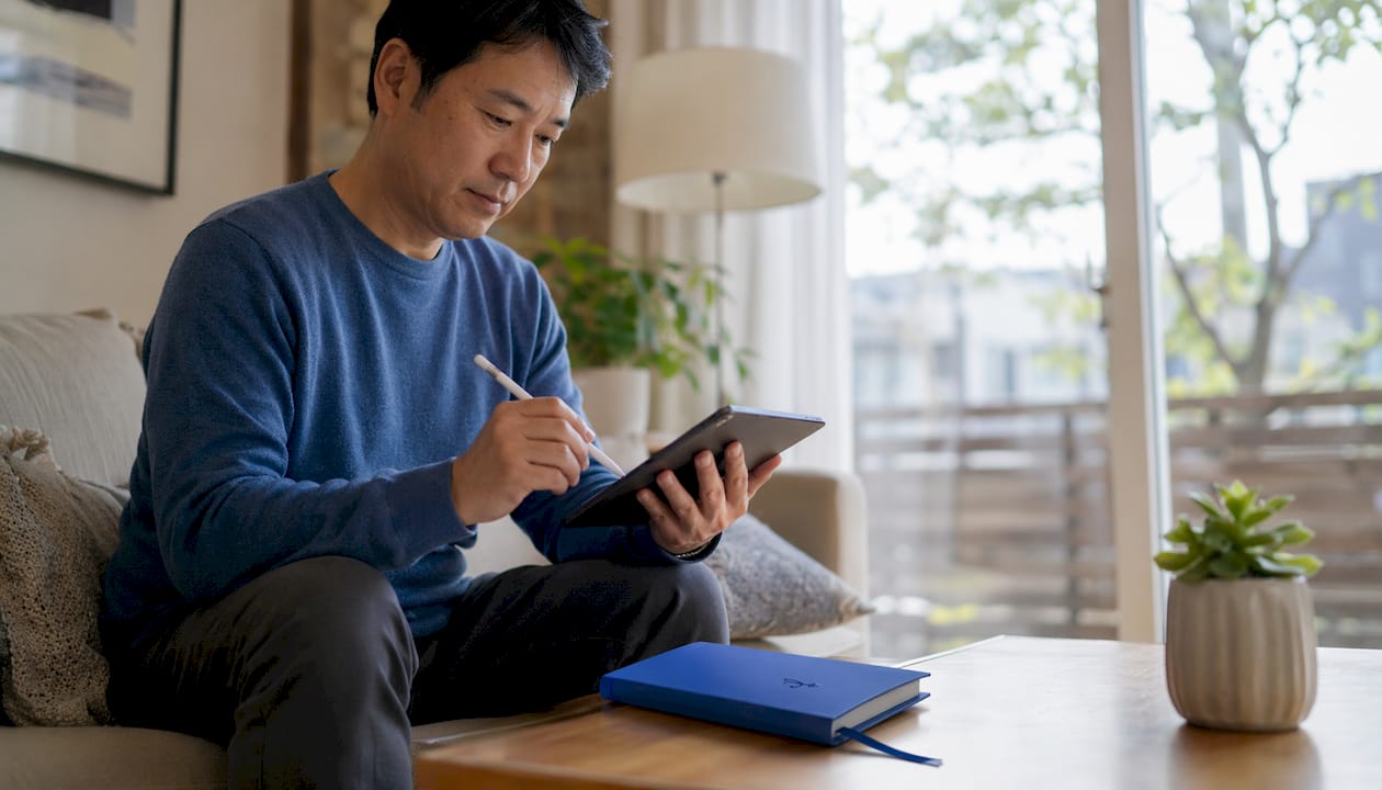 Man using AI app for Japanese learning at home office