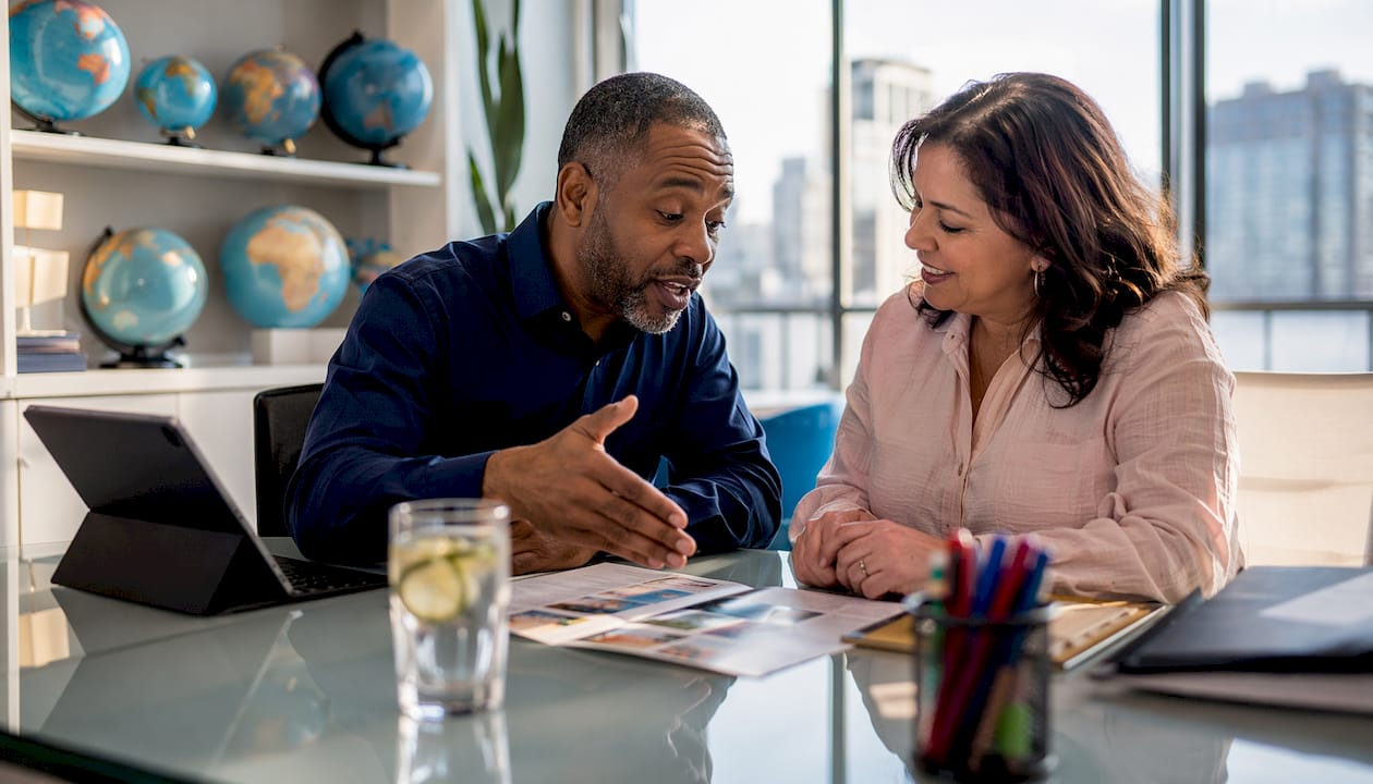 Travel advisor consulting client in agency