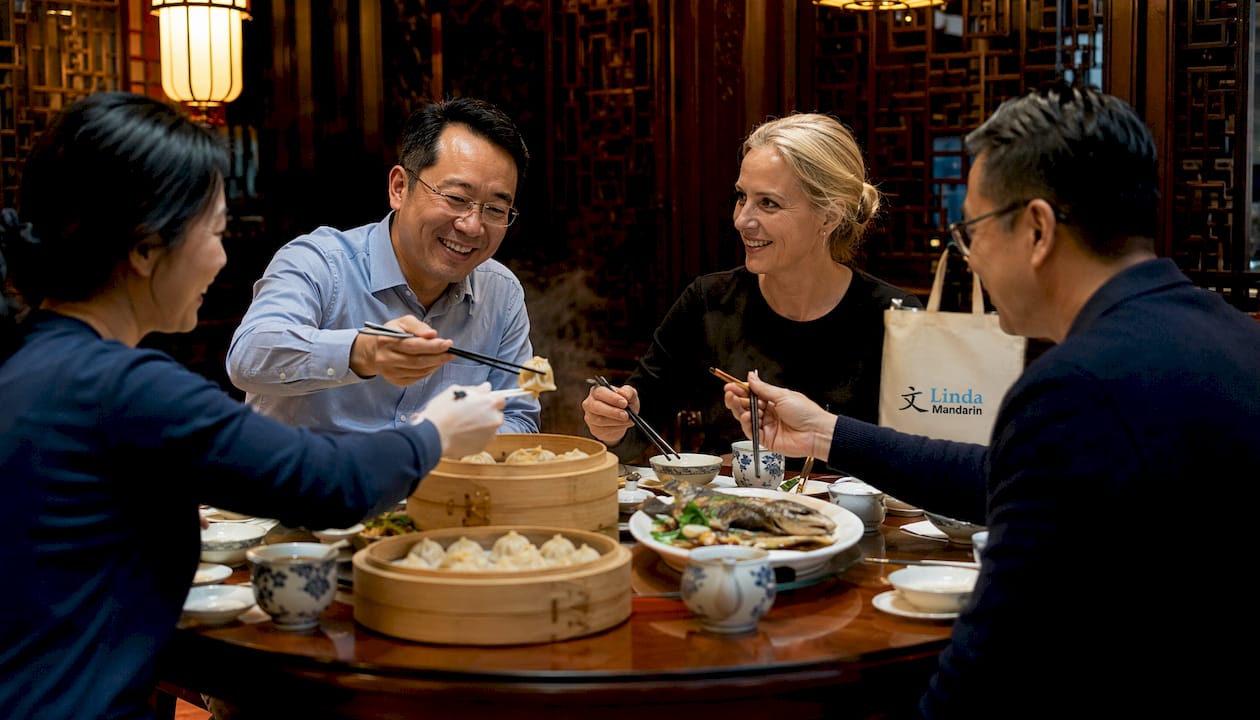 Group sharing meal at Chinese business dining table