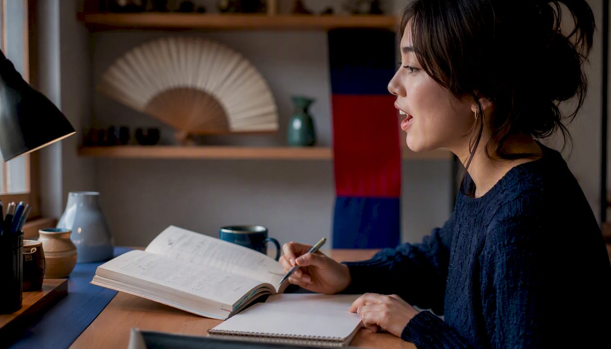 Learner practicing Korean speech aloud at home