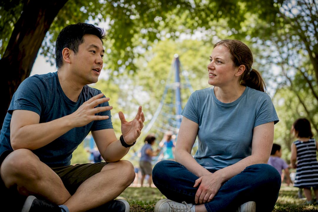 Adults practicing Mandarin conversation outdoors