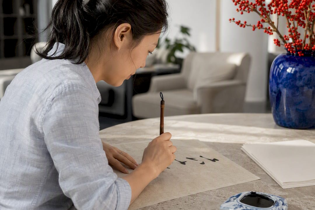 Brush pen writing Mandarin characters close-up