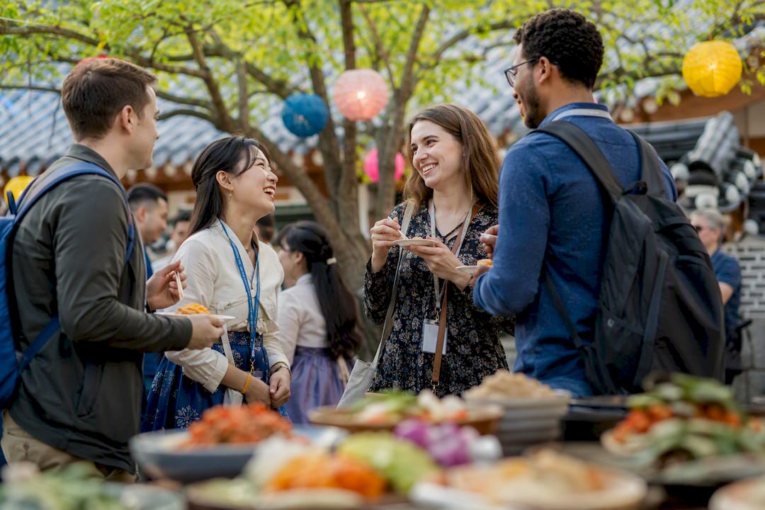 Adults participating in Korean cultural event