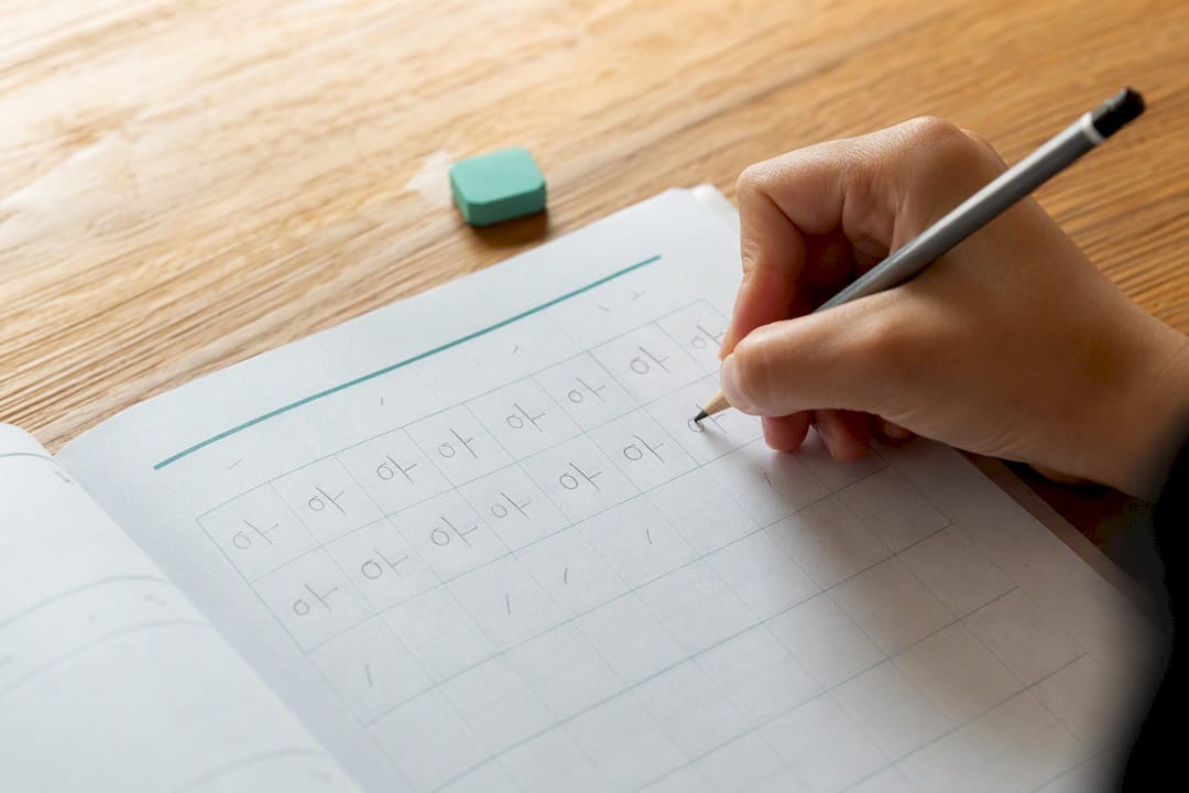 Close-up of Korean handwriting practice sheets