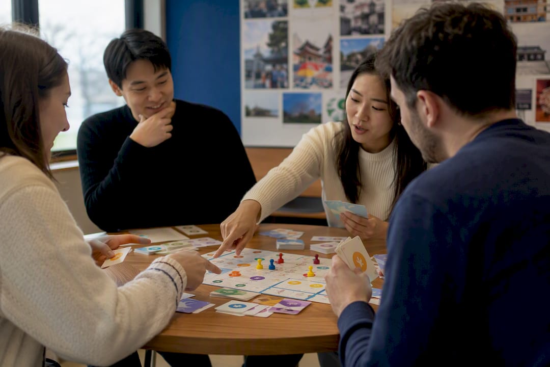 Hands of small group studying Korean flashcards