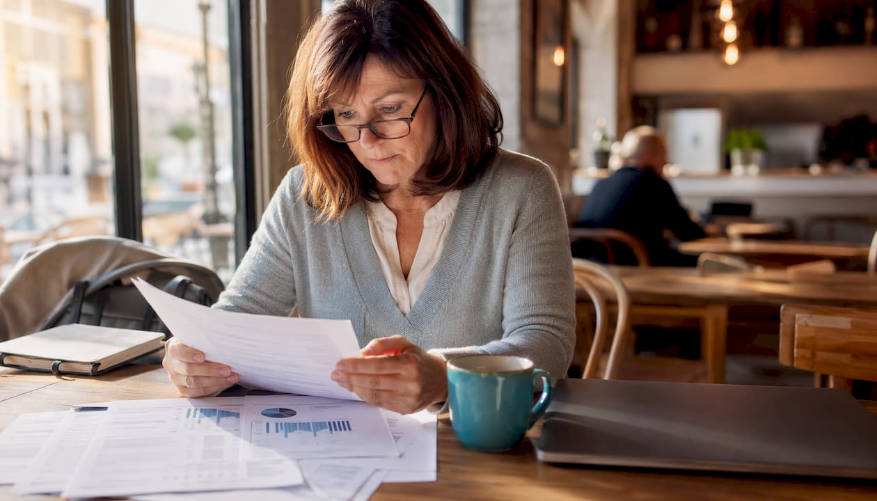 Accountant reviewing SEO audit report at home desk