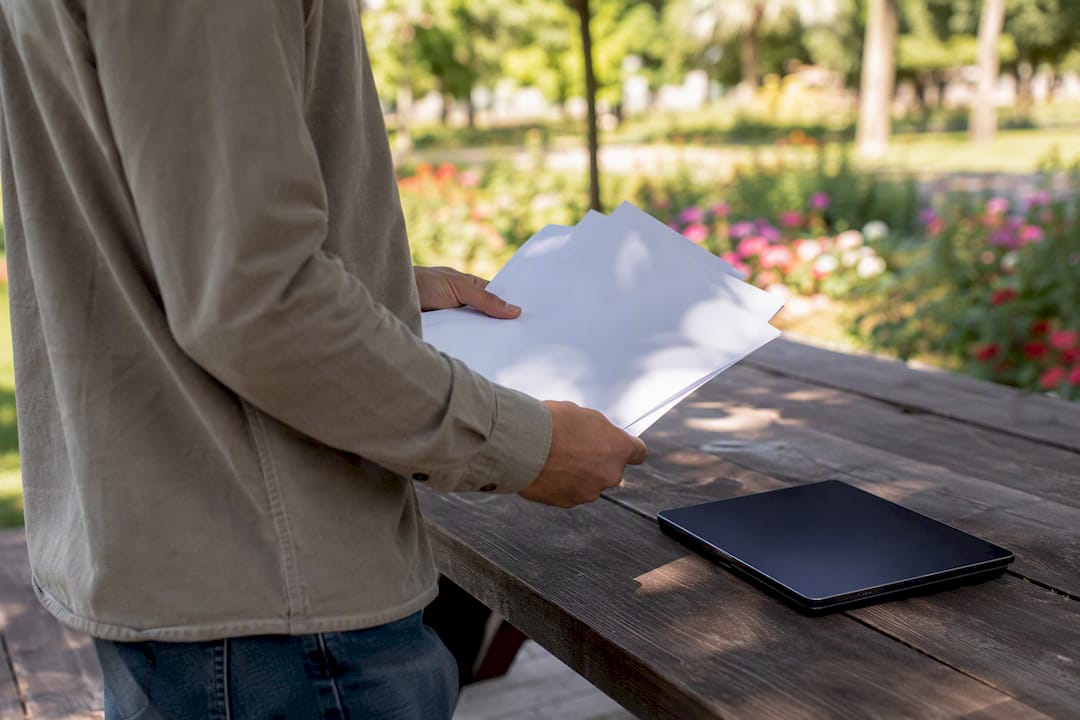Marketing manager handling SEO checklists outside office