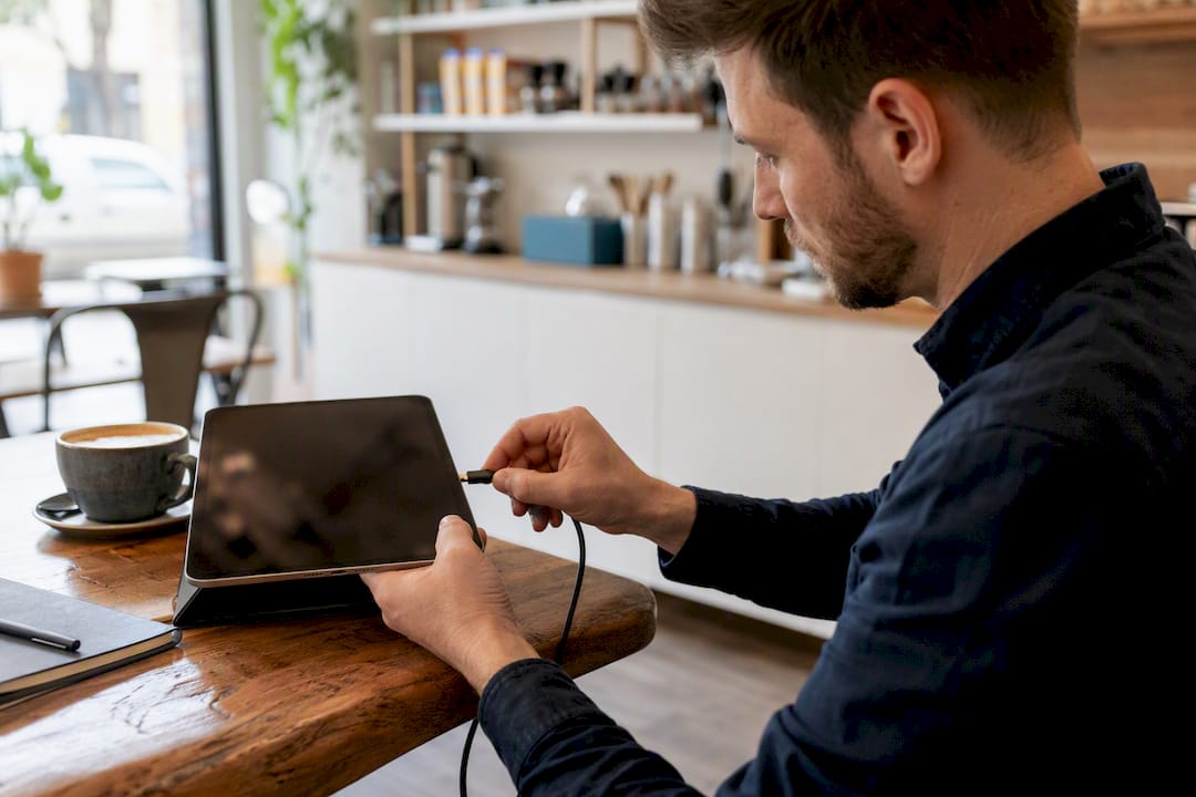 SEO specialist connecting tablet for audit in service van