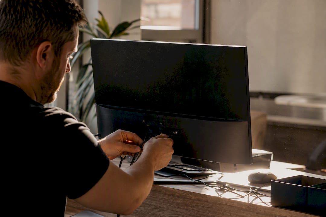 Hands connecting cables during SEO tech audit