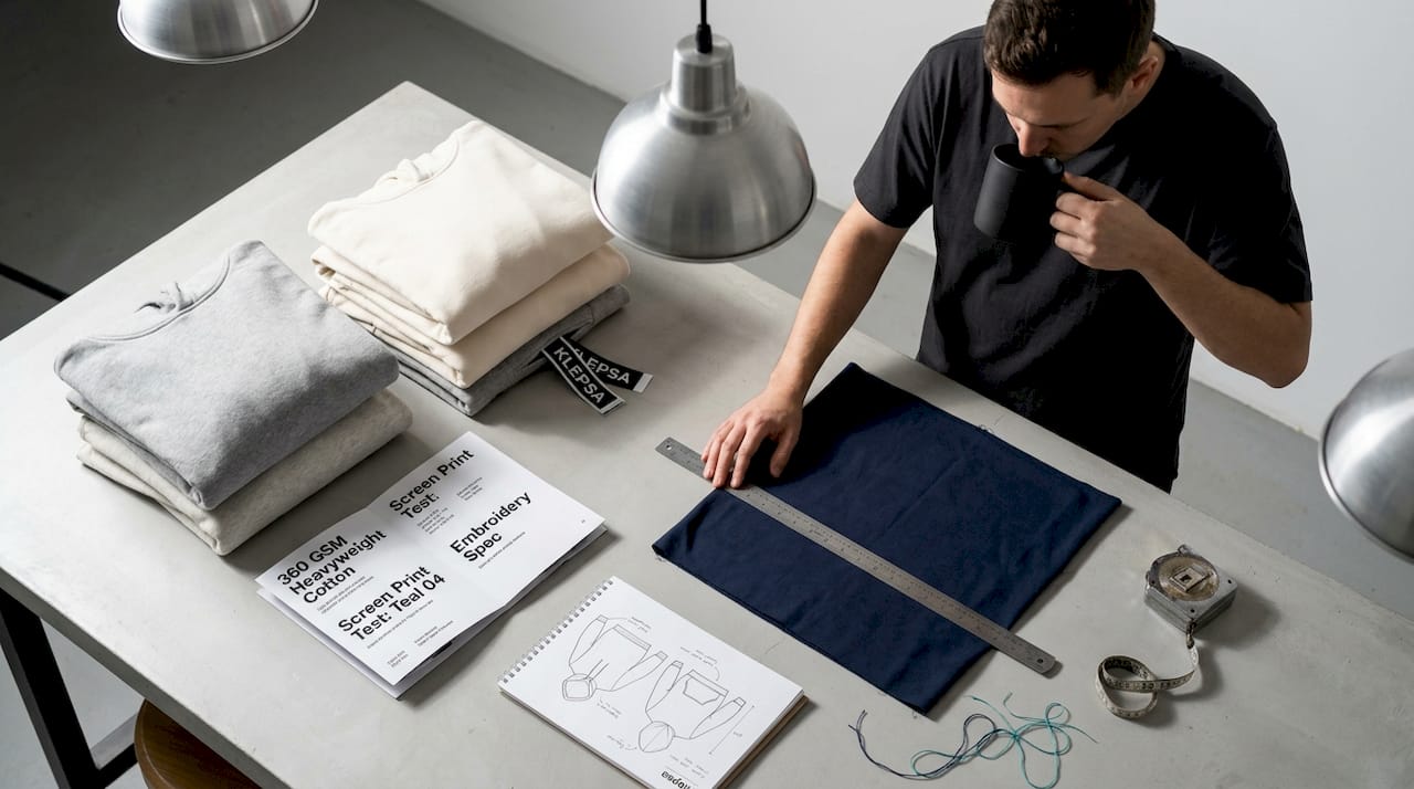 Designer selecting premium streetwear fabric