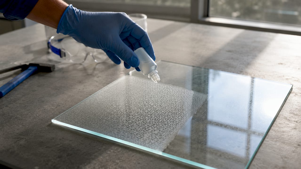 Close-up of acid etching on glass surface
