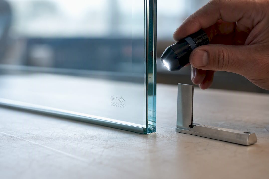 Close-up of etched safety glazing mark