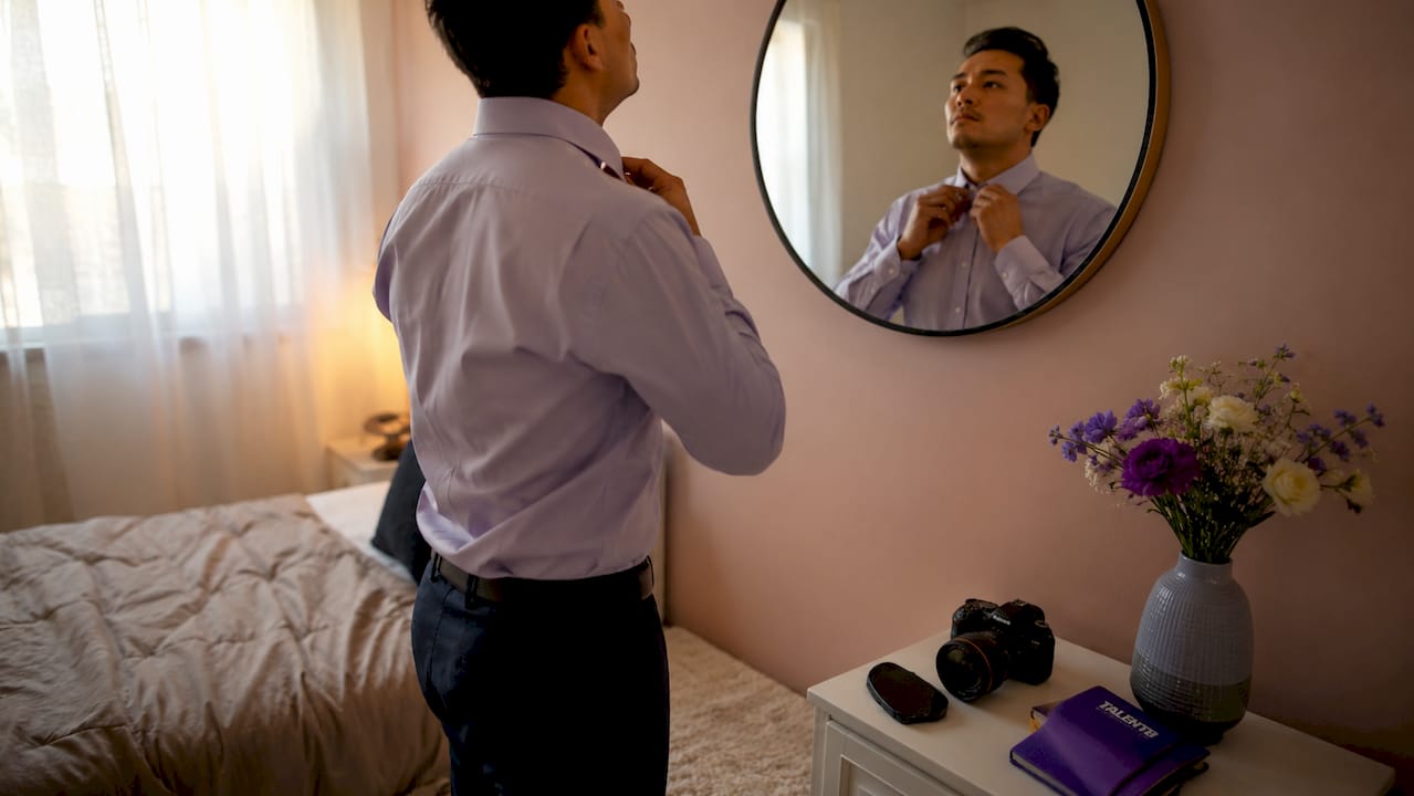 Professional preparing for headshot in home office