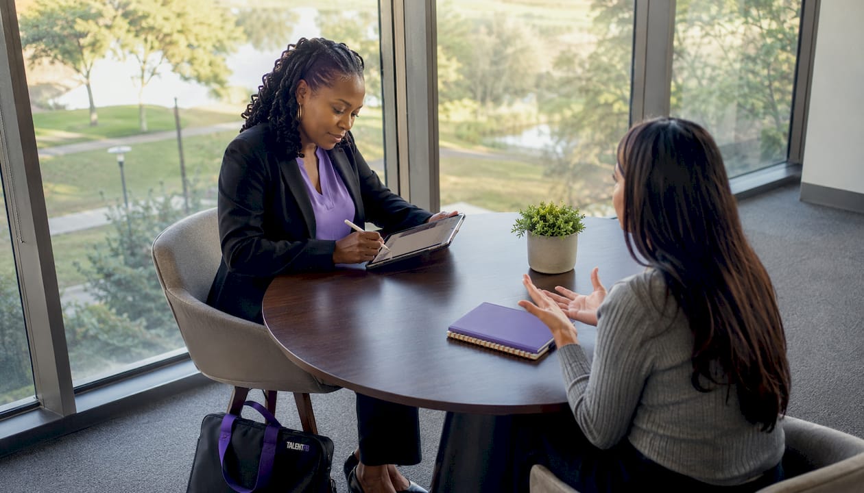 Coach and client in coaching session