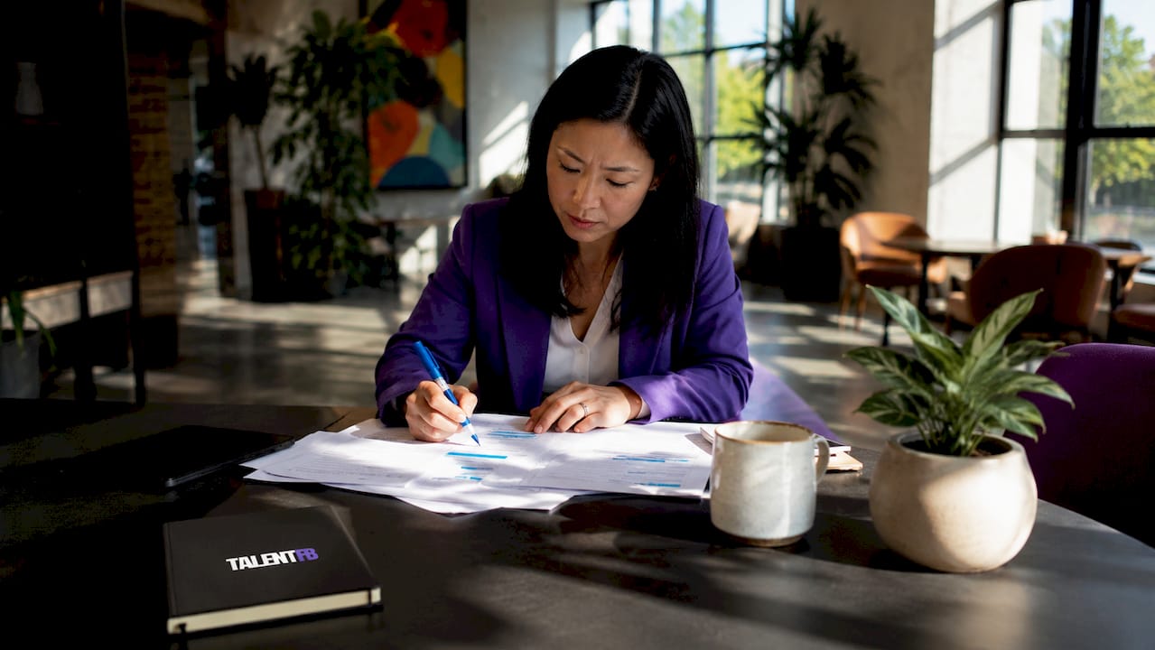 Executive reviewing career strategies in office