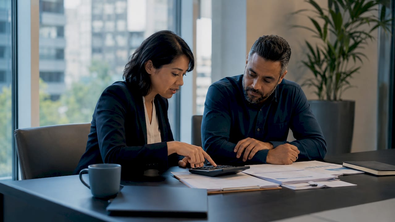 Advisor explaining financial factors to client