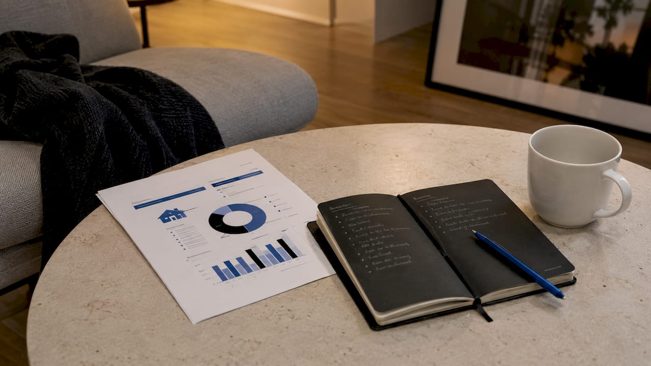 Flat lay of property investment planning materials