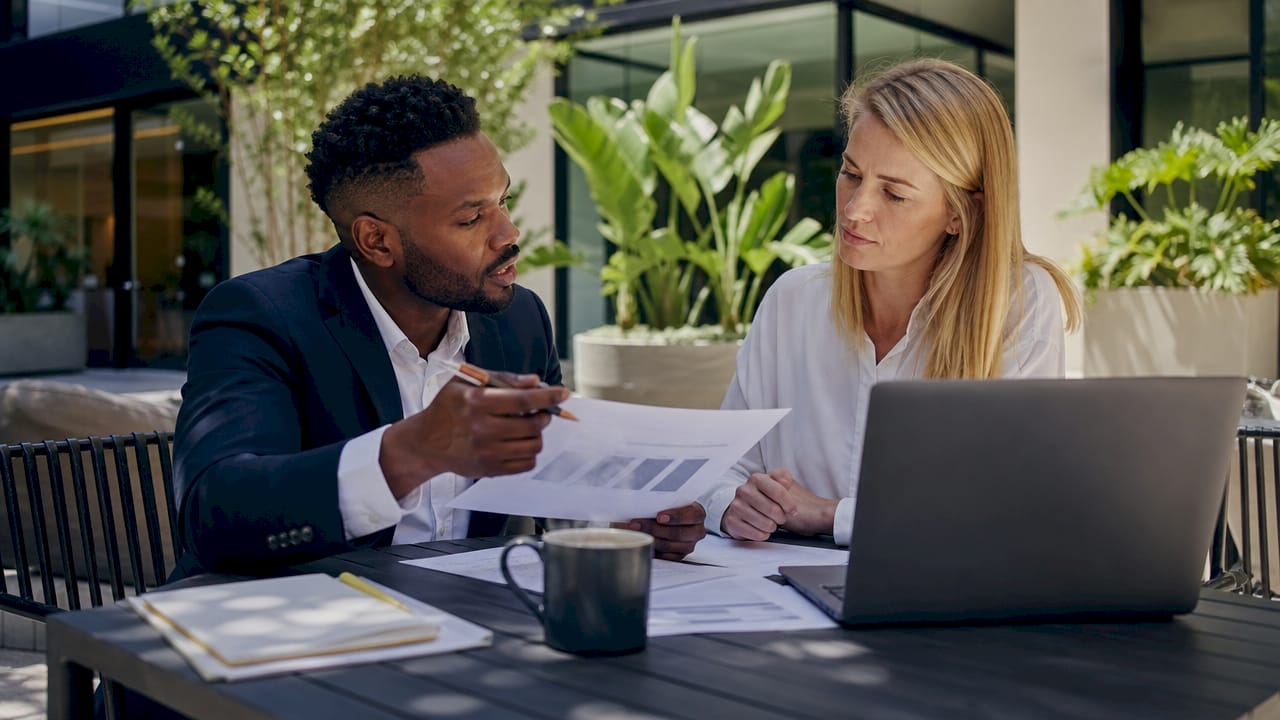 Investor and advisor discussing rental appraisal report