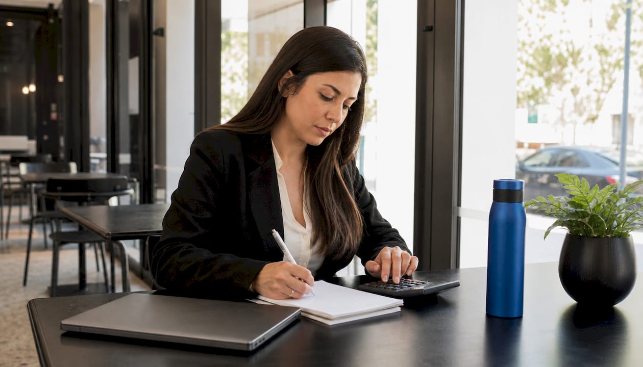 Advisor calculating usable equity with calculator and notes