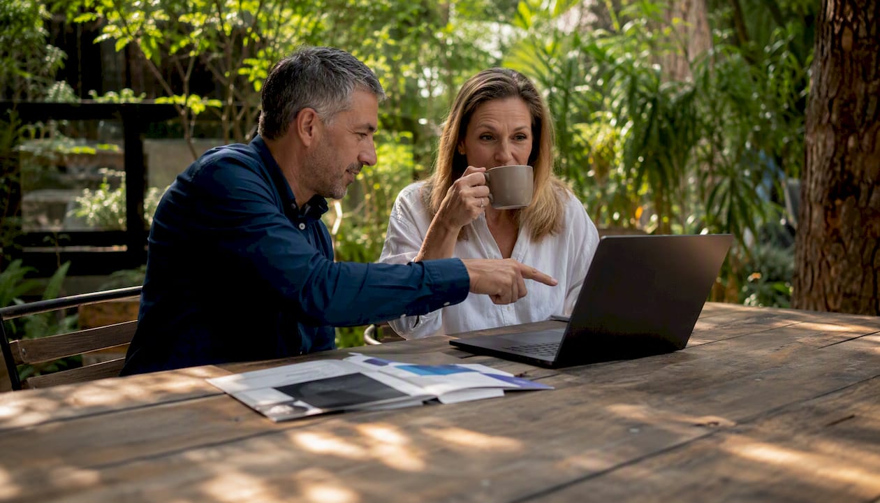 Couple discussing investor loan options in café