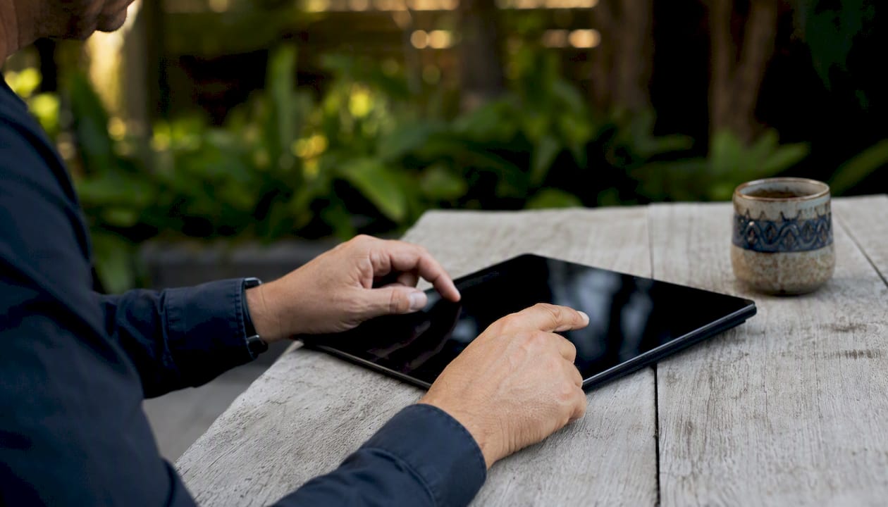 Hands interacting with tablet for property modelling
