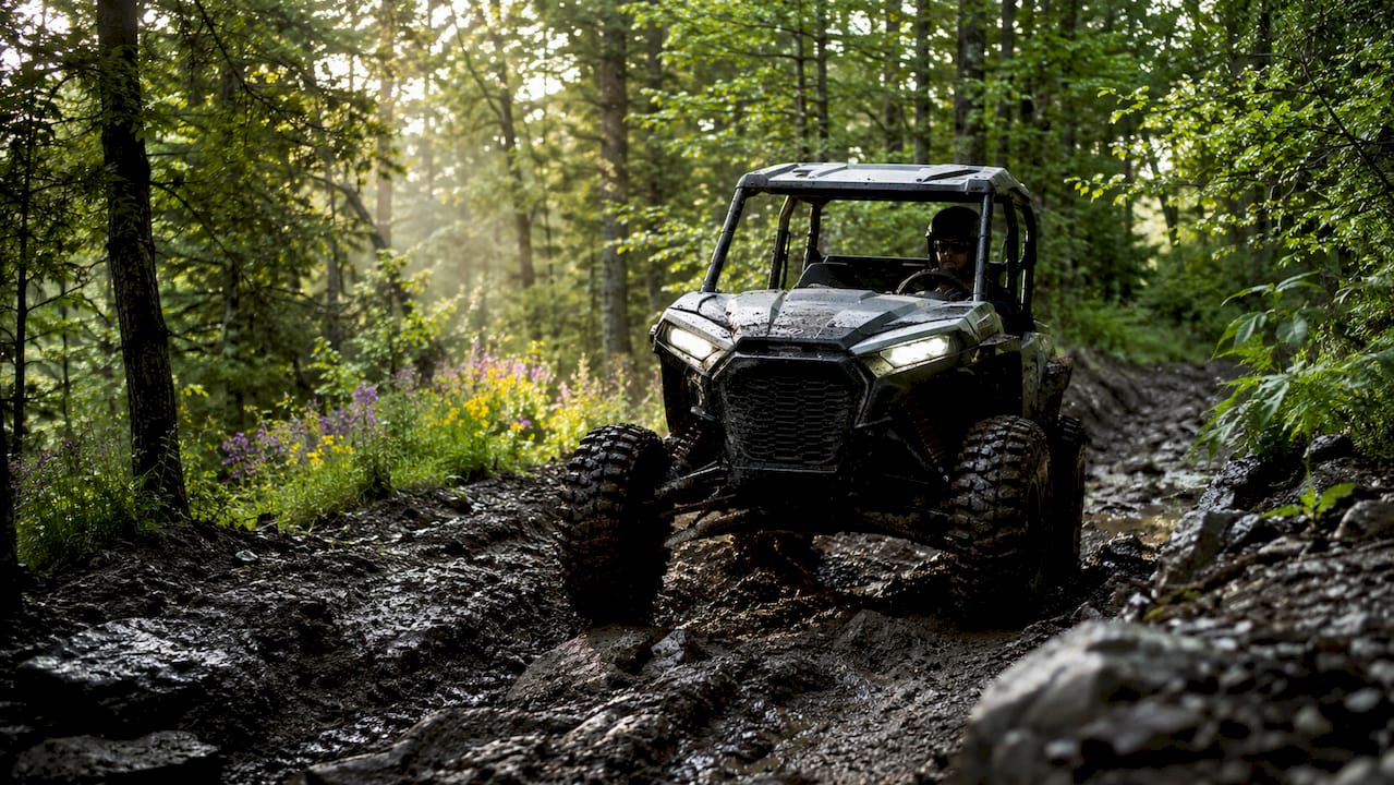 Close-up of off-road tire traction on muddy ground