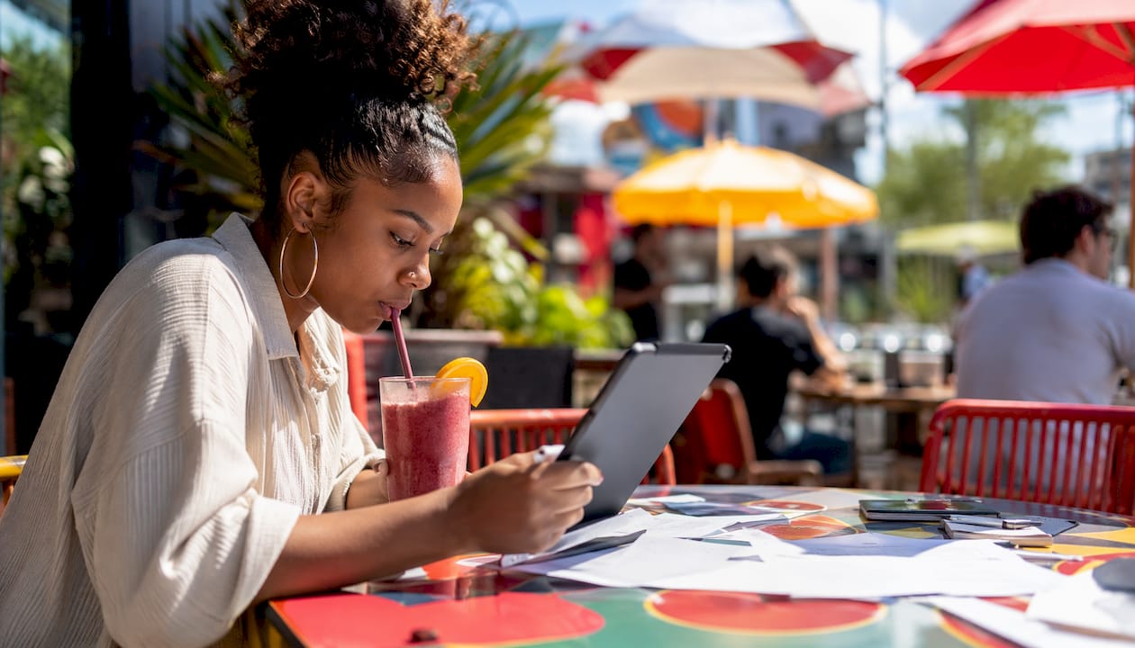 Hands reviewing online vehicle payment on tablet
