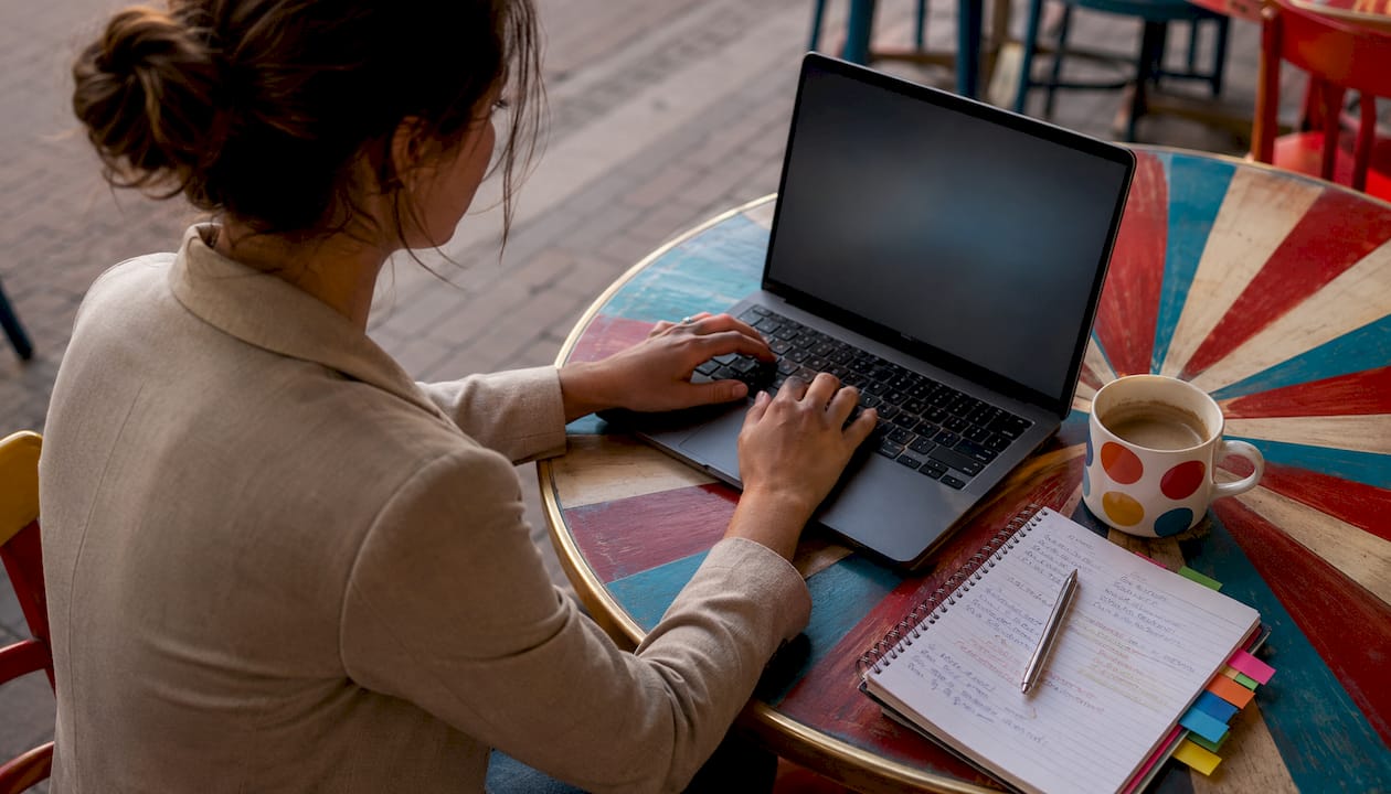 Woman typing on laptop at coworking space