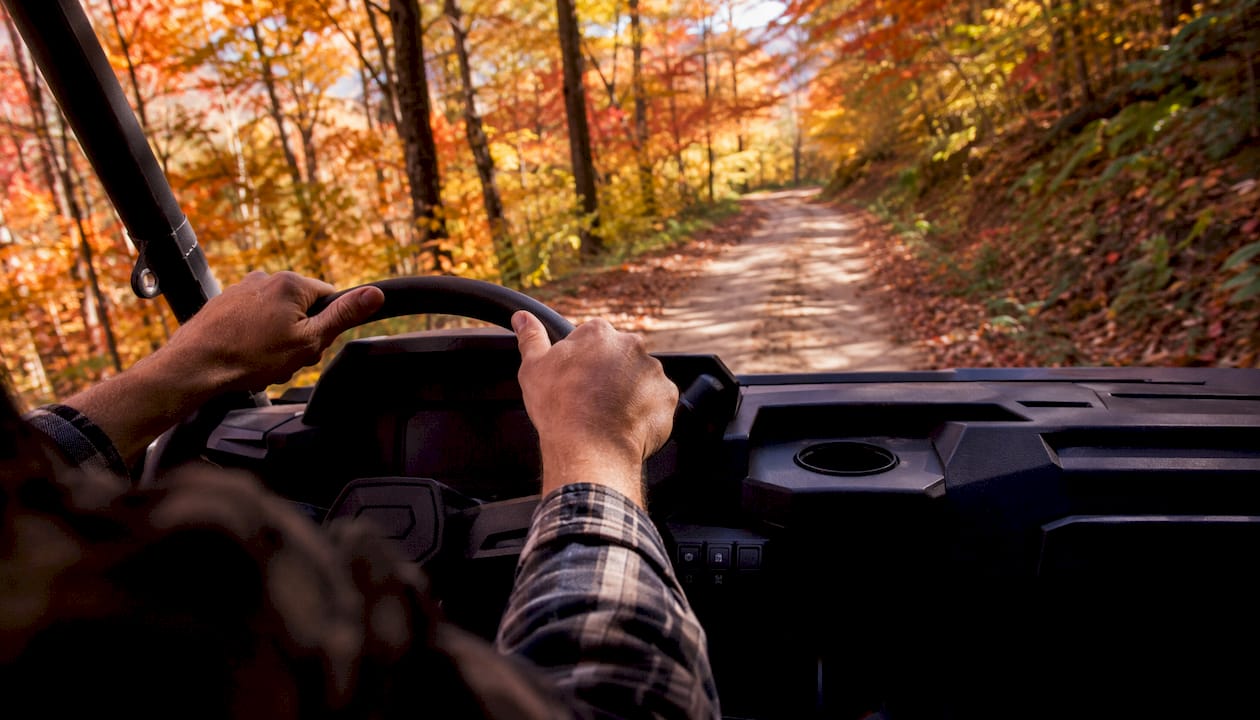Hands on steering wheel driving electric cart uphill