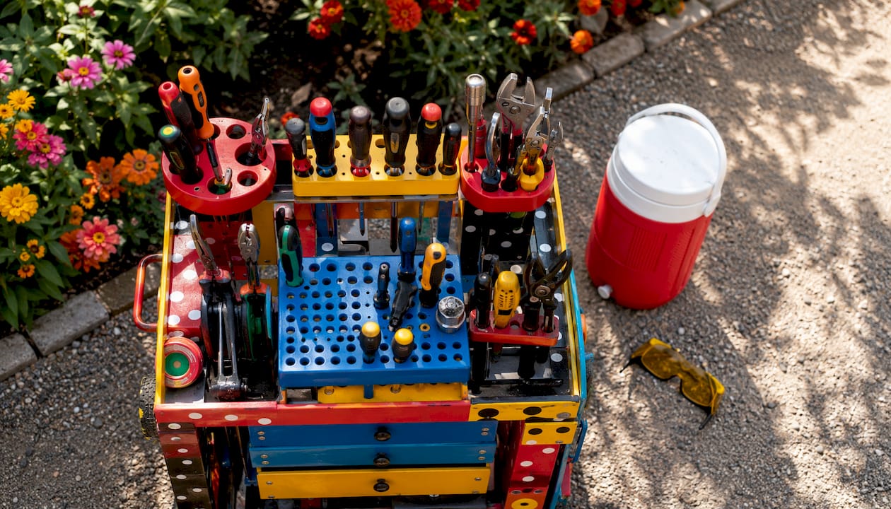 Utility cart tool holders with maintenance tools outdoors