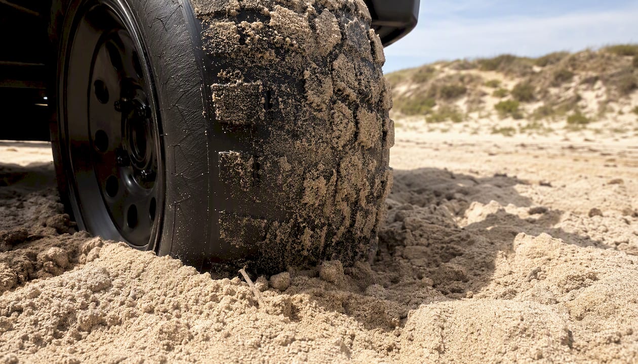 Wide low pressure sand tire in beach sand