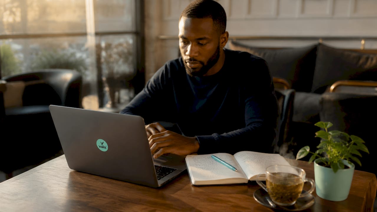 How To Create Your Annual Financial Plan For 2026 2 Hands typing on laptop with budget spreadsheet