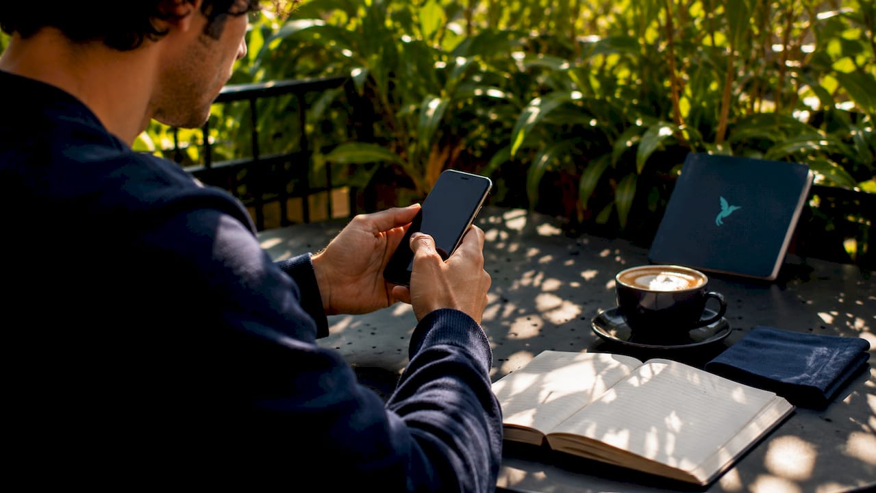 Financial Planning For Young Professionals: 2026 Guide 2 Hands setting up budget automation on smartphone