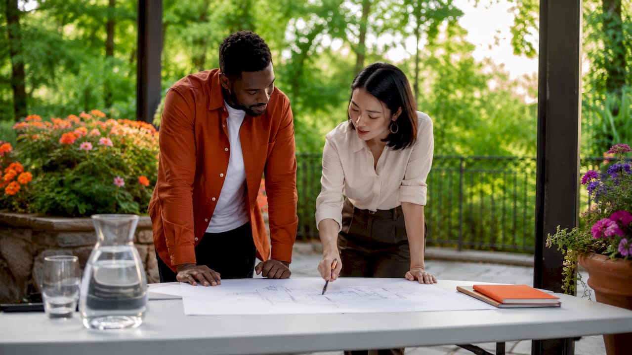 Venue coordinators reviewing meeting room layout