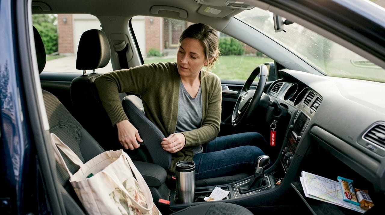 Driver enhances comfort inside parked car