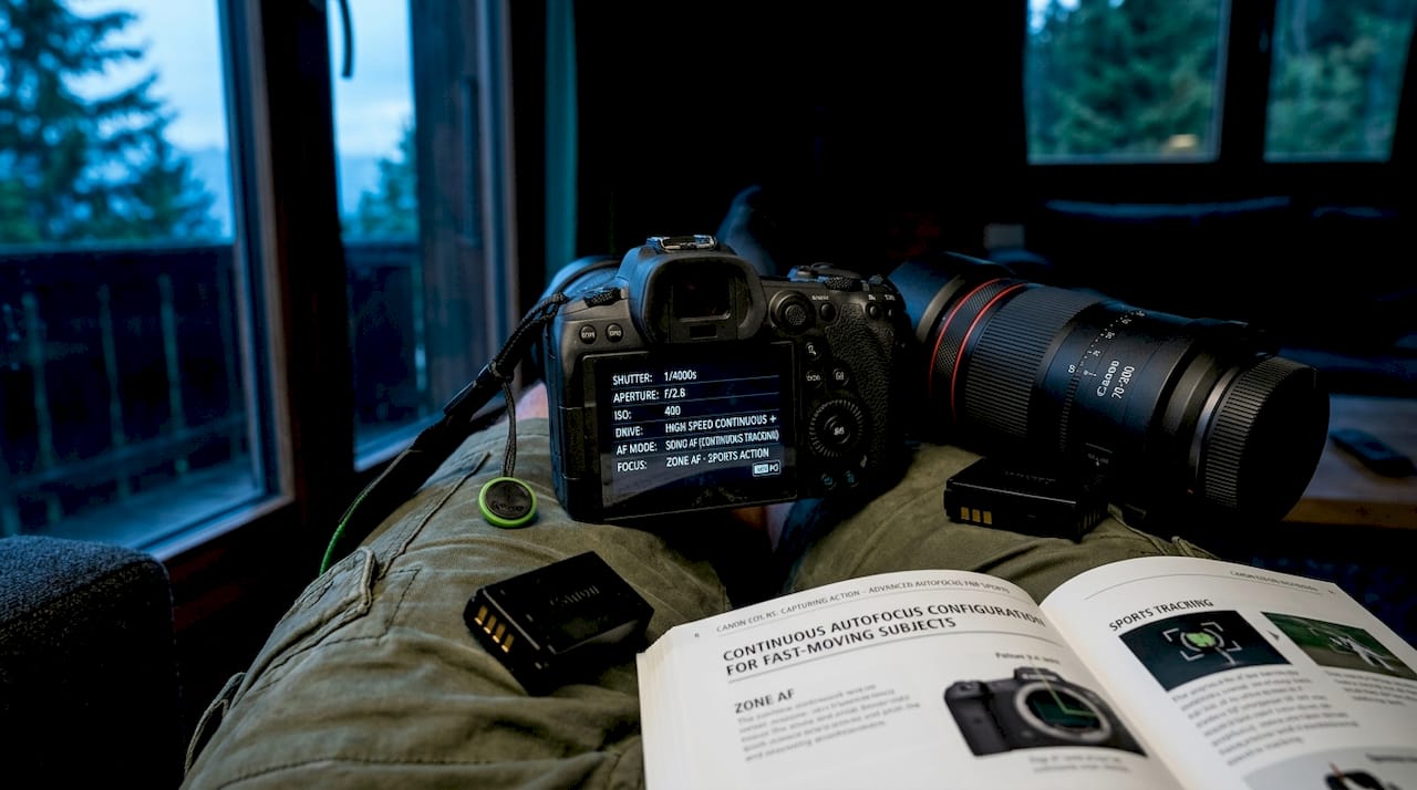 Close-up of camera showing sports photography settings