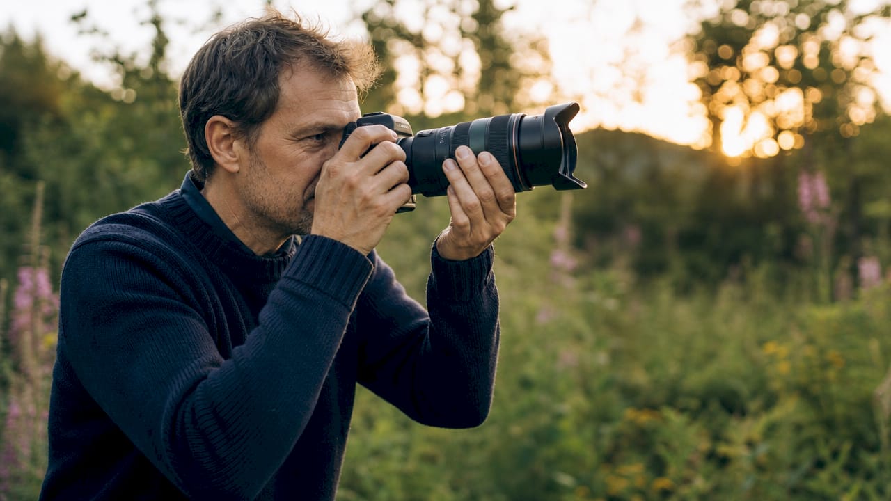 Photographer capturing candid editorial moments outdoors