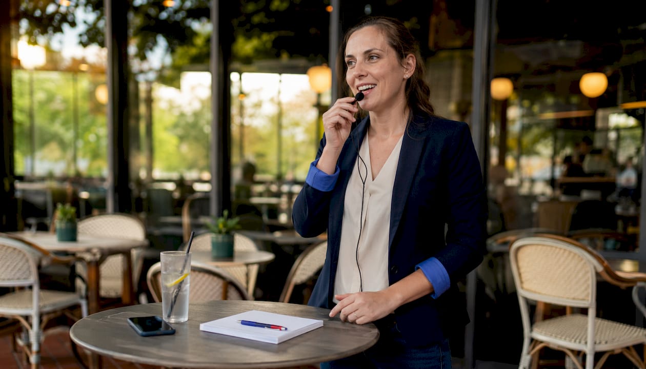 Real estate agent using CRM and headset in office