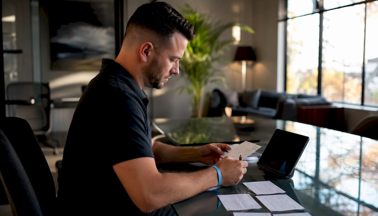 Hands preparing probate lead call follow-up materials