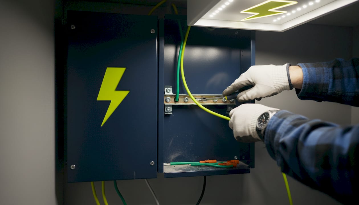 Close-up of grounding wire connection in panel