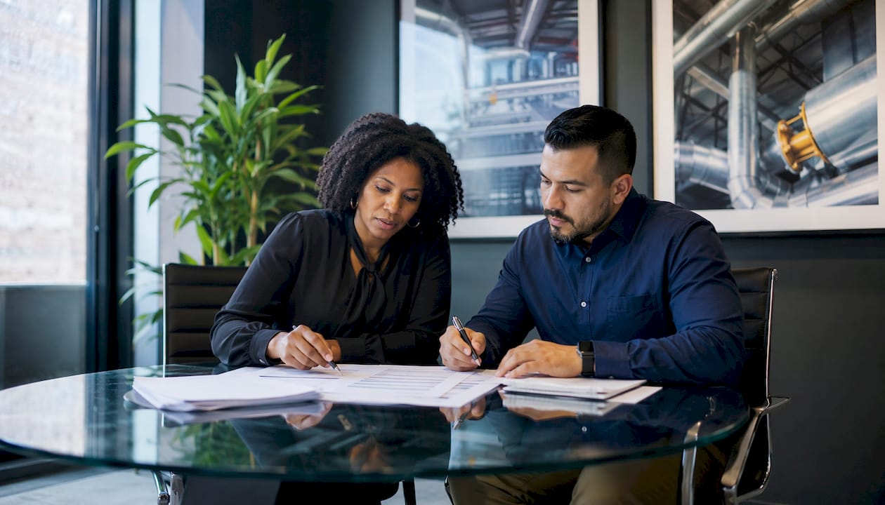 Property managers discussing competitive HVAC bids