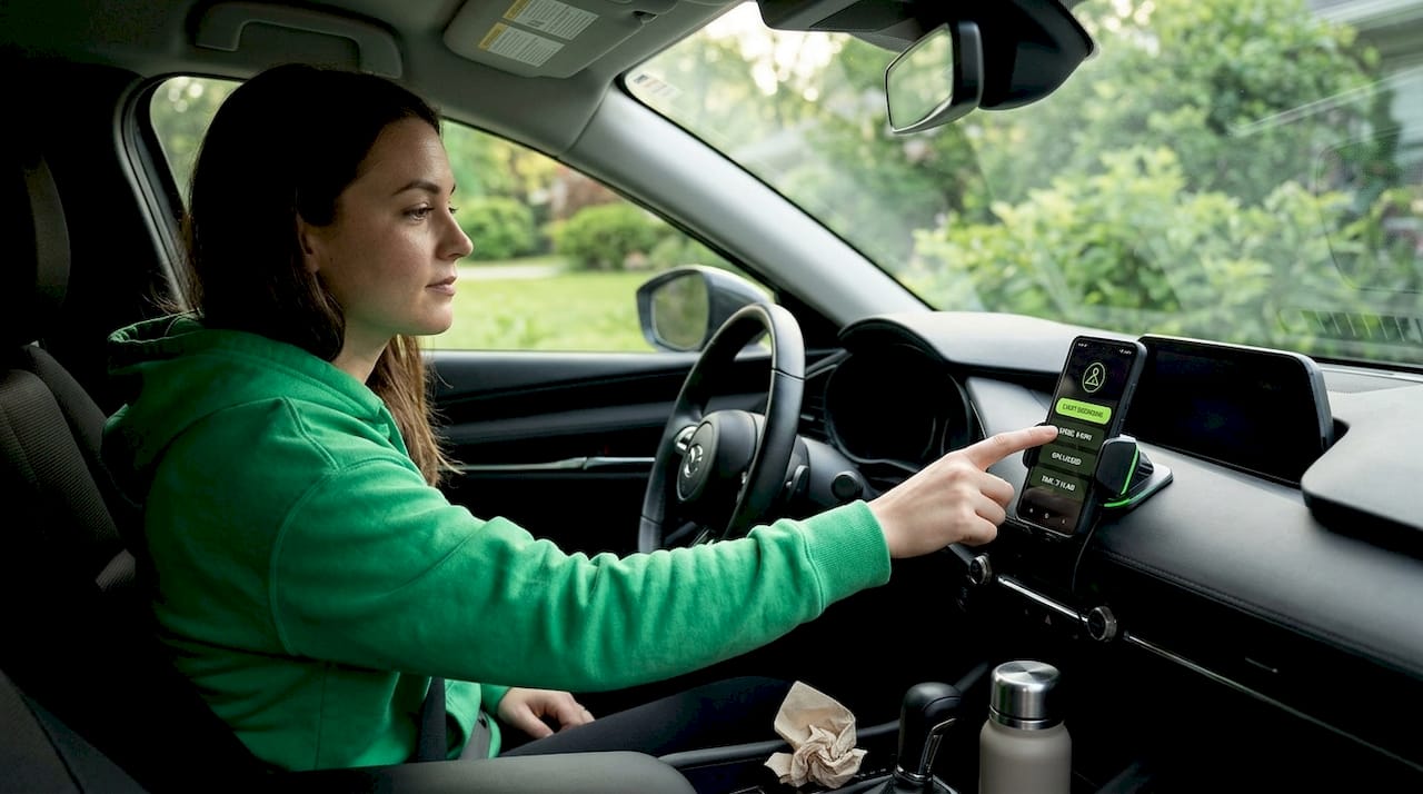 Woman manually starts dashcam on phone